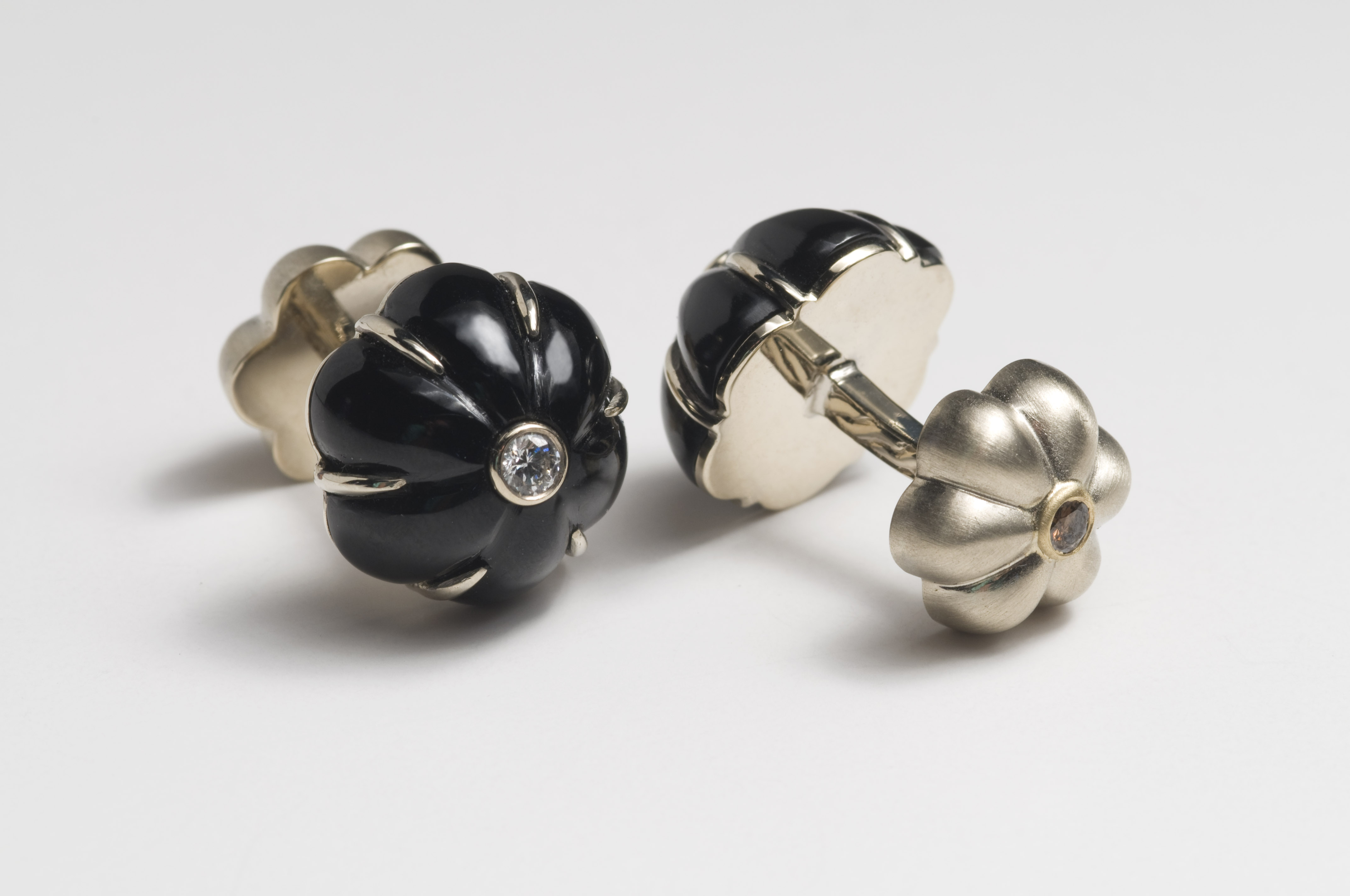 Black onyx dome cufflinks with diamond center in white gold